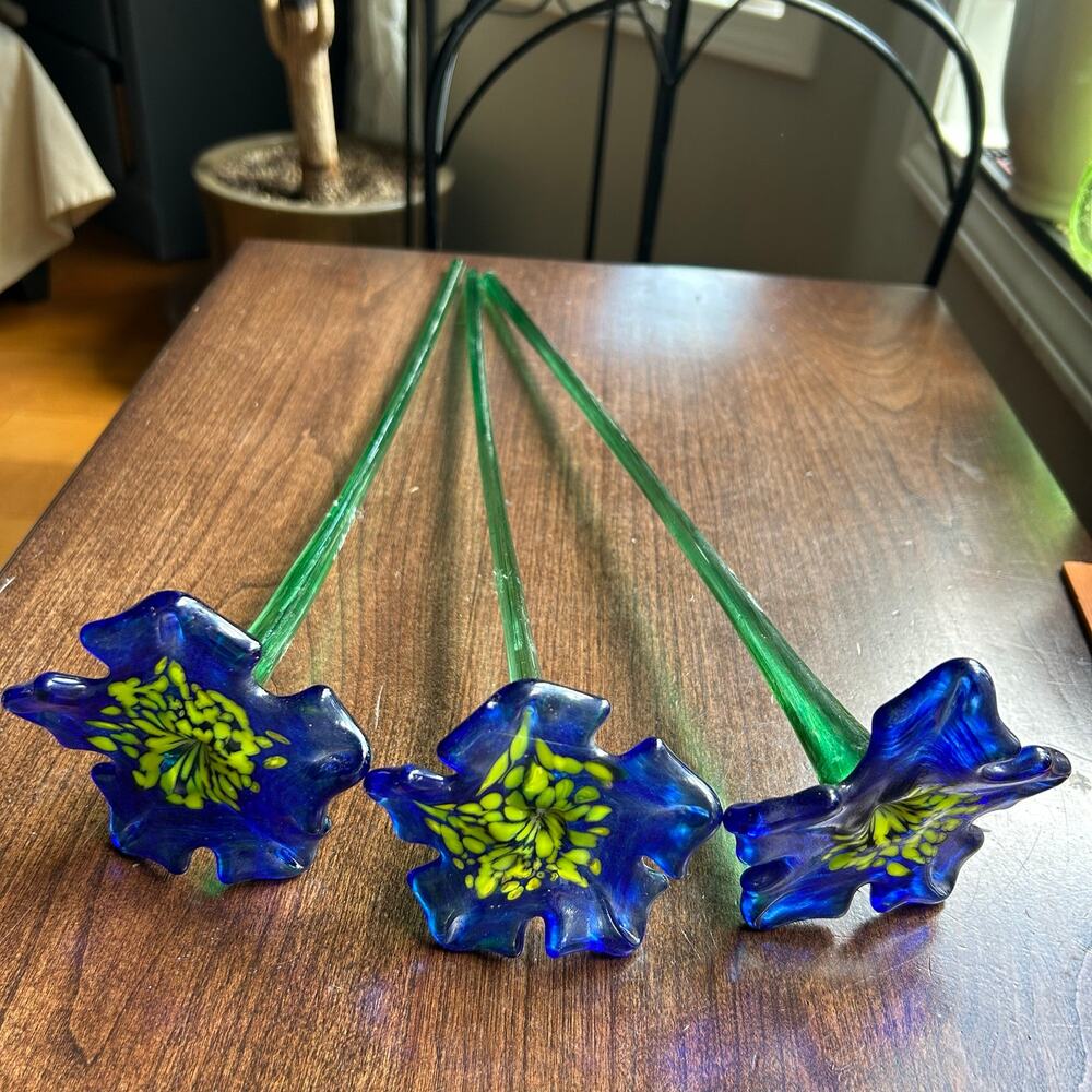 Handcrafted blue and yellow glass flower sculptures long green stems